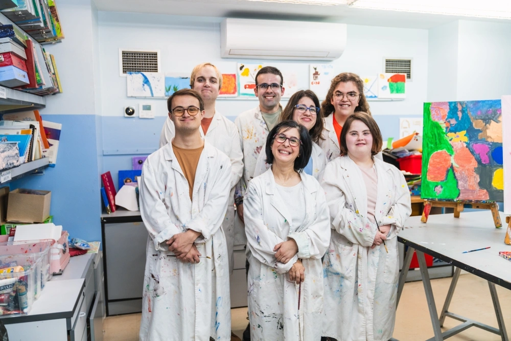 group of friends with different disabilities in a painting and drawing class