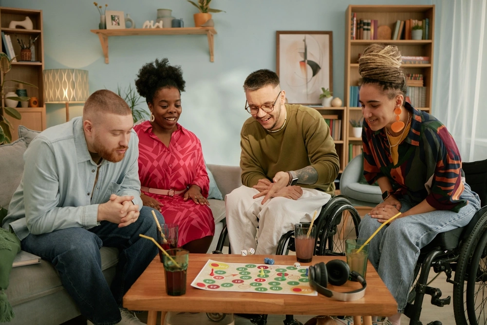 group of disabled friends playing board games